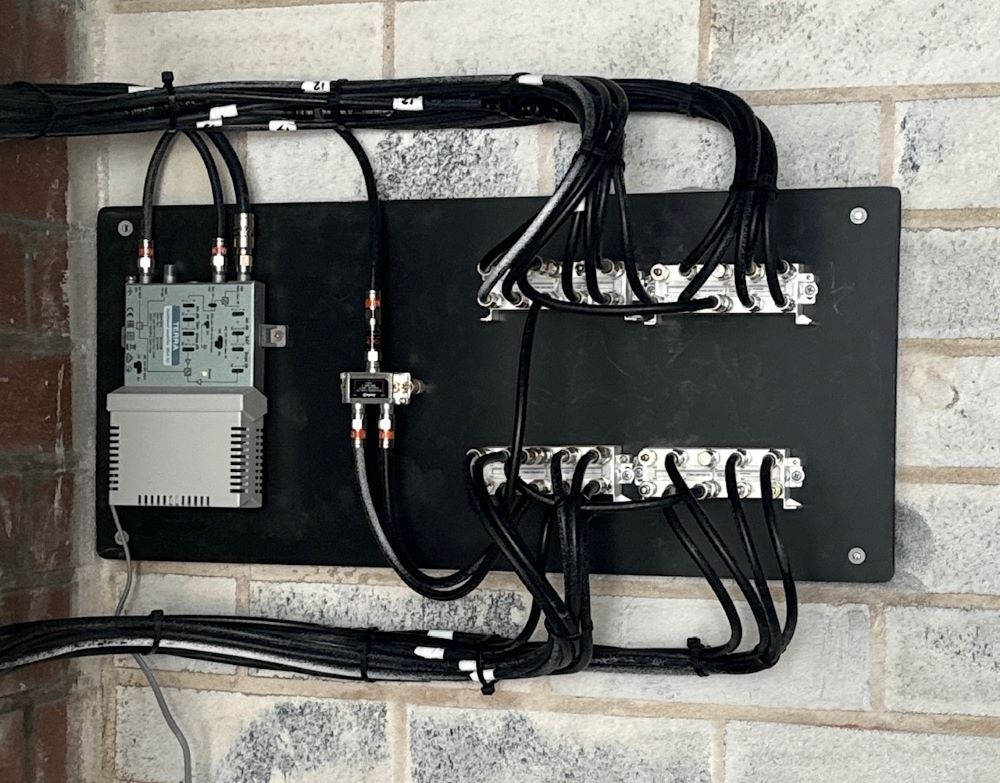 A Bunch of Wires Are Connected to A Brick Wall — MATV Systems Australia Pty Ltd in Wickham, NSW