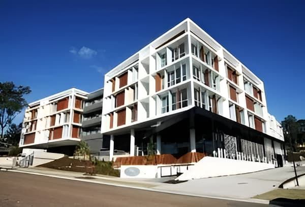 Modern White and Brown Multi-story Building With Large Windows — MATV Systems Australia Pty Ltd in Wickham, NSW