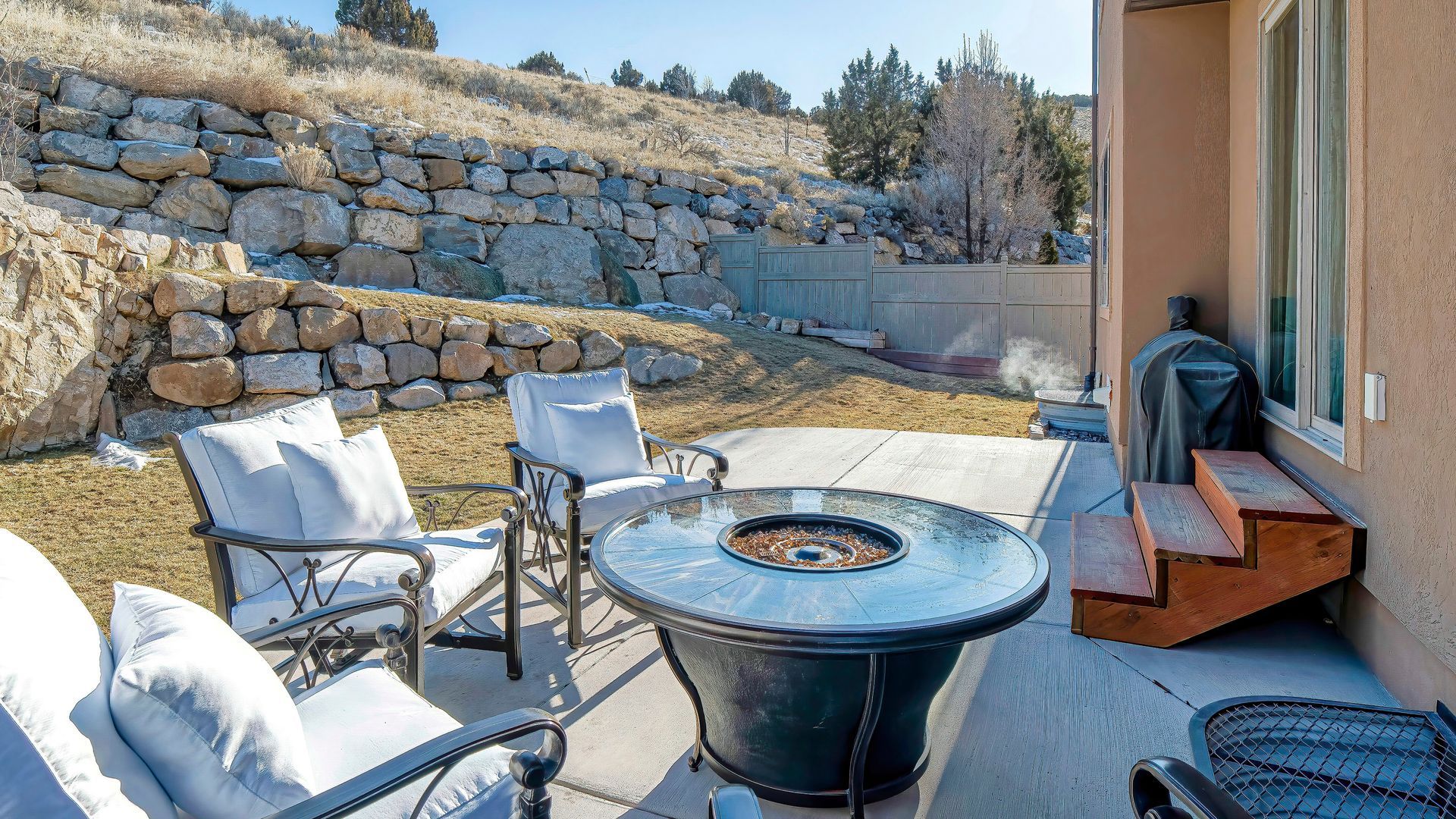Patio with a stone retaining wall Patio with a stone retaining wall