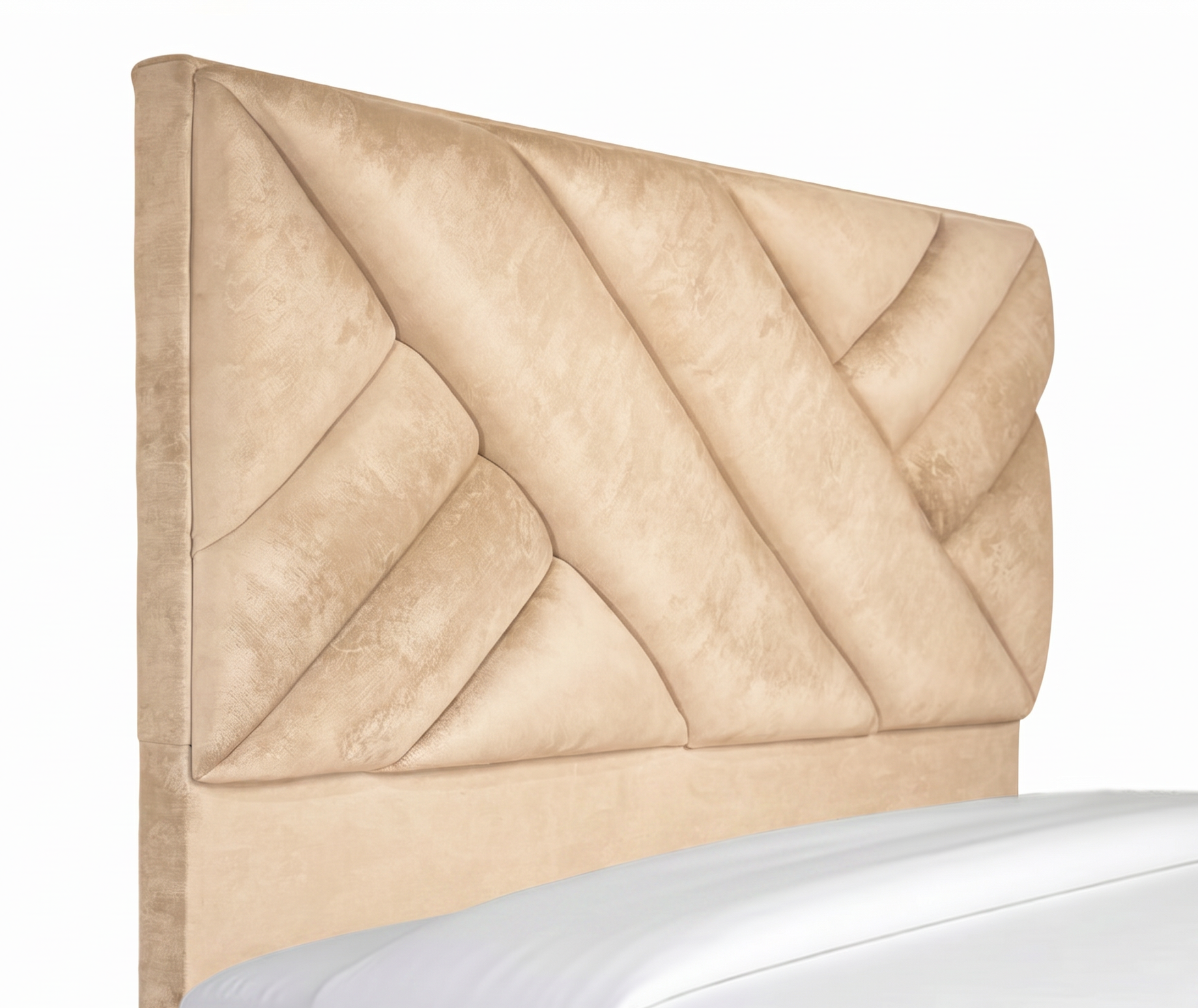 Cabecero de cama tapizado en color beige con paneles capitoné diagonales y almohadas blancas.