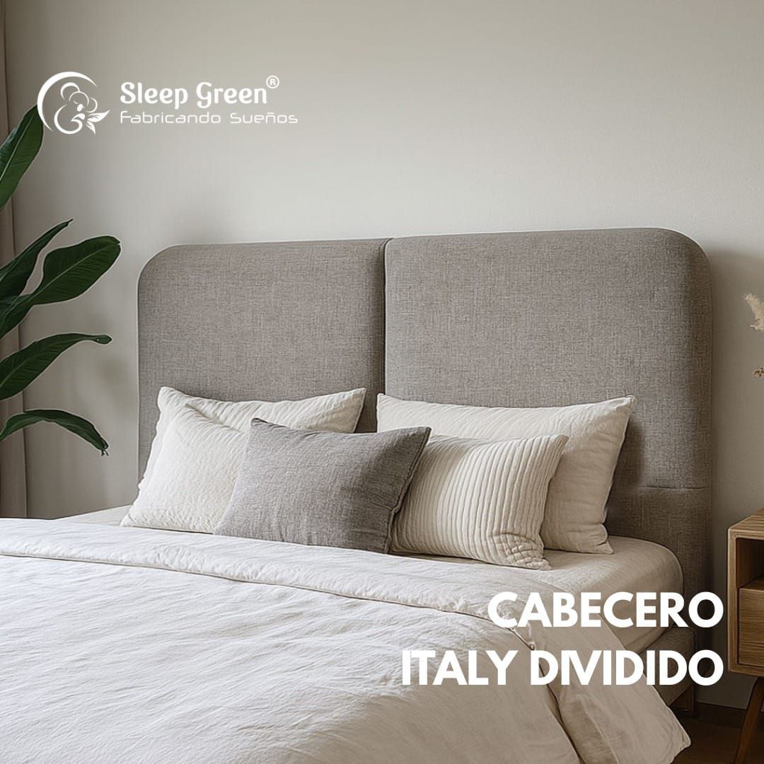 Cama con cabecero dividido tapizado en color beige, ropa de cama blanca y almohadas de tonos neutros en un dormitorio luminoso.
