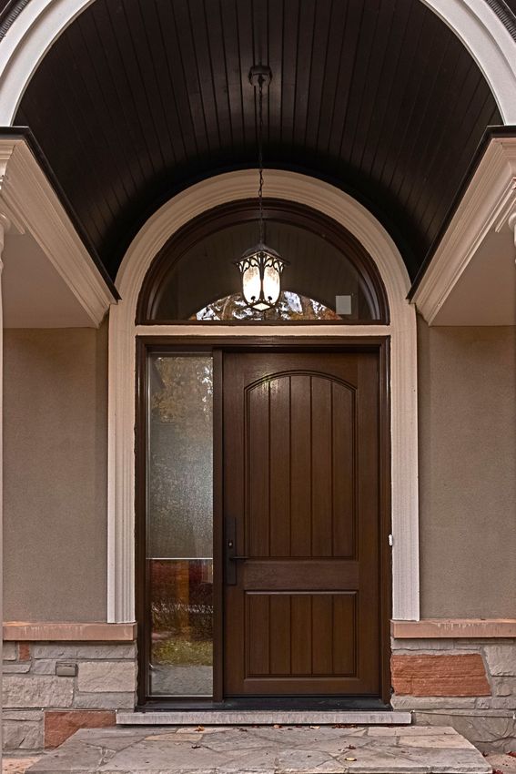 The front door of a house has a ceiling above it