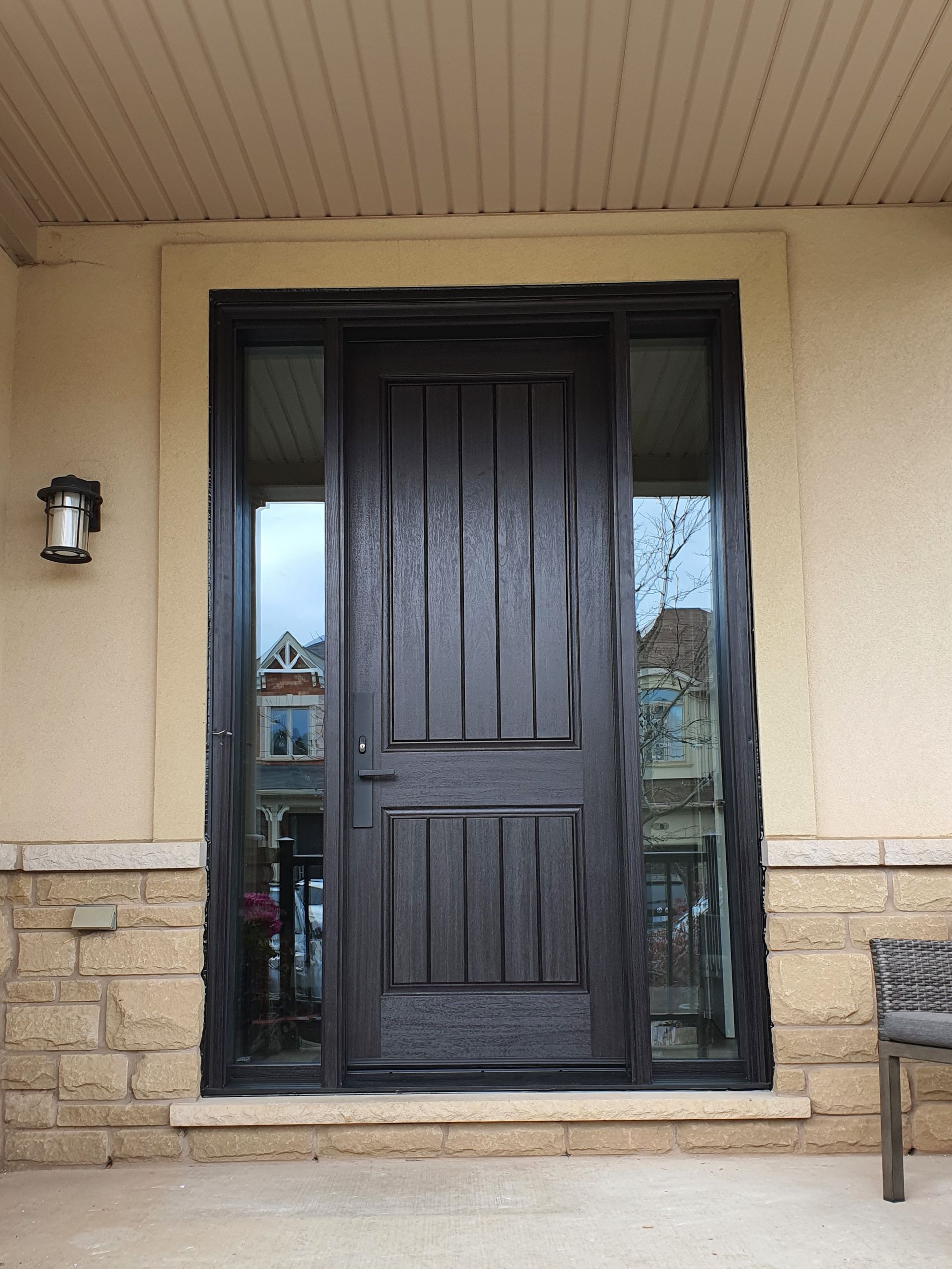 The front door of a house with a black door