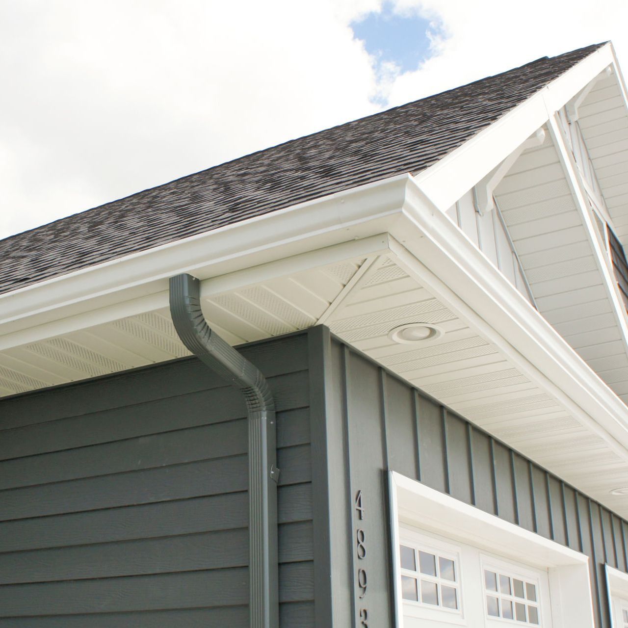 A house with a gutter on the side of it