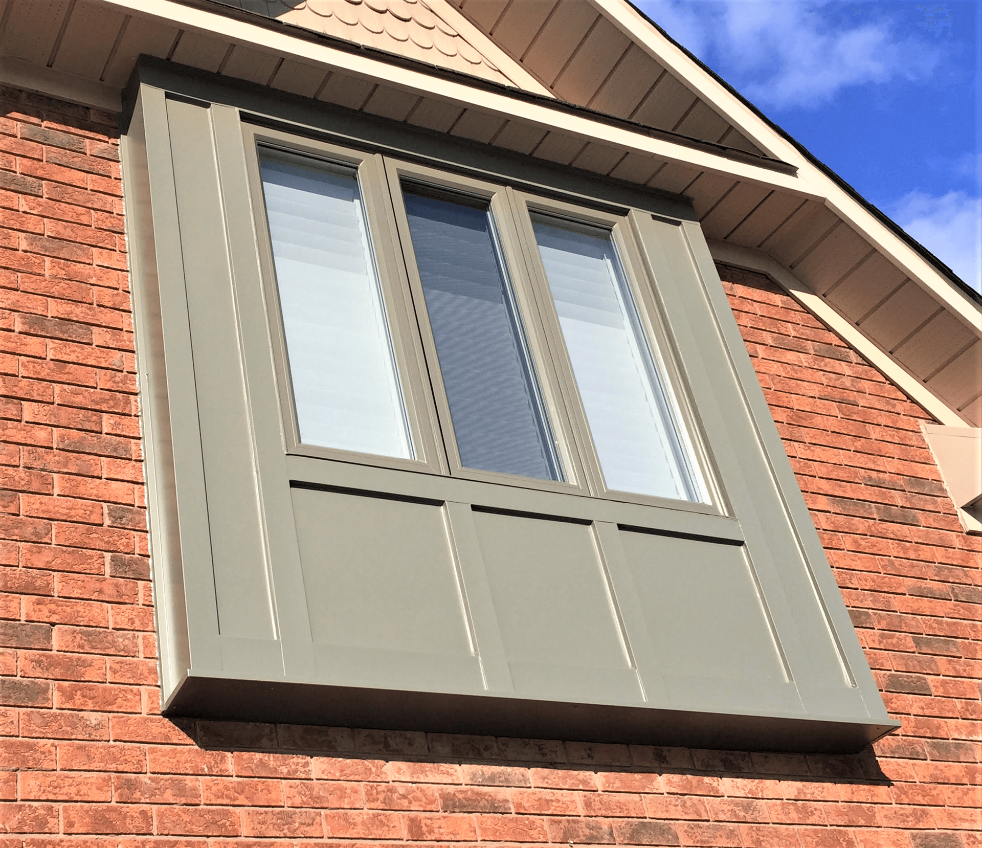 A window on the side of a brick building