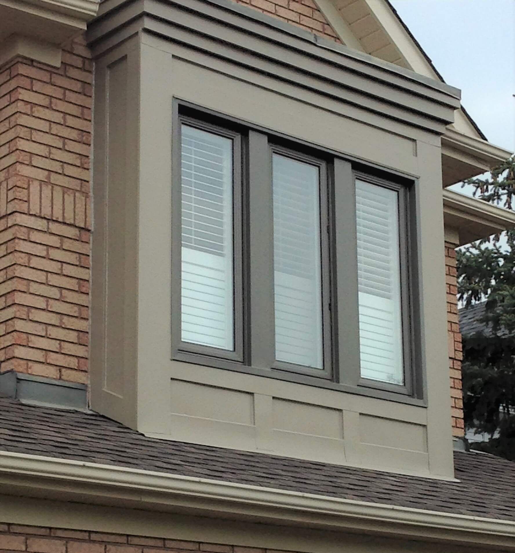 A large window on the side of a brick building