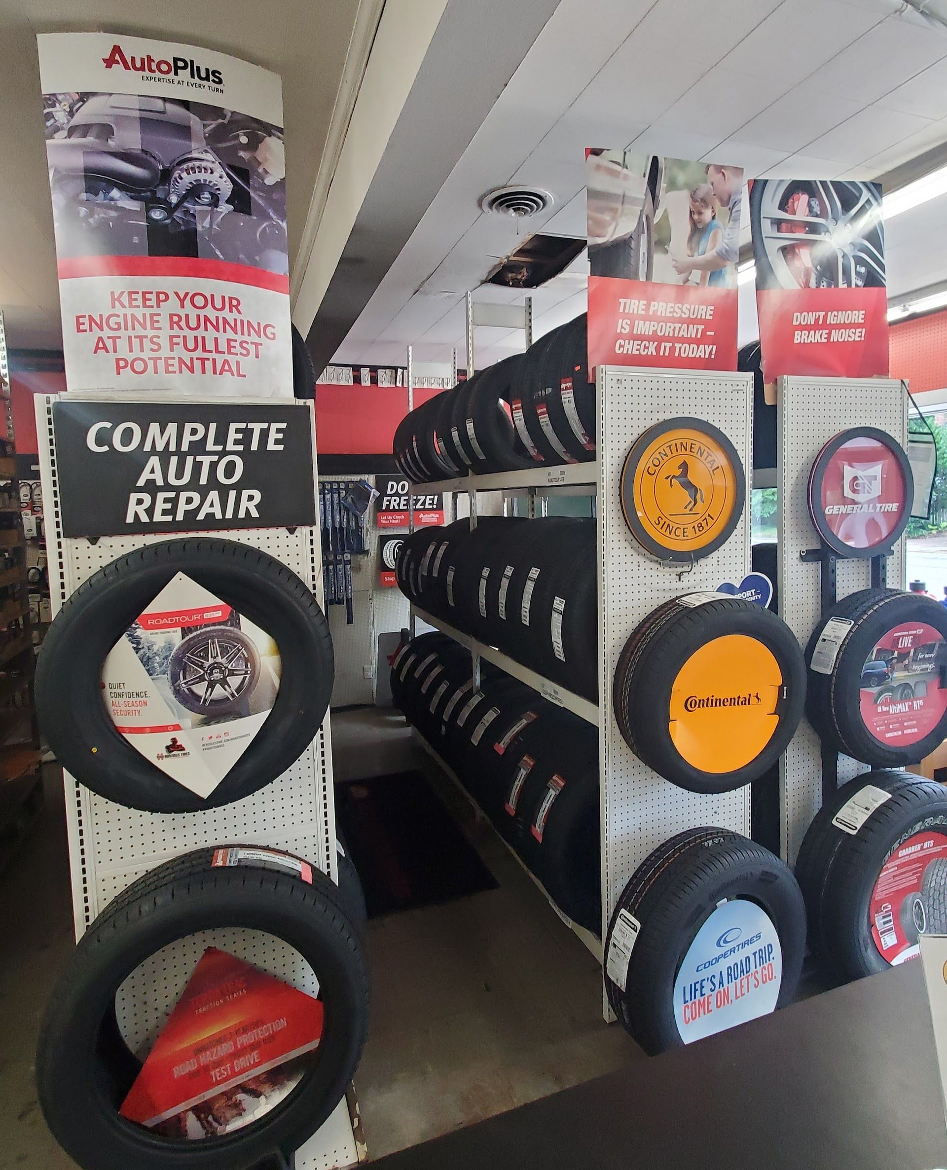 Tires displayed in a car repair shop, showcasing different brands | Western Tire & Auto of Centreville