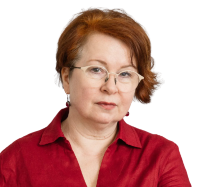 Woman with red hair and glasses in a red shirt, looking at the camera.