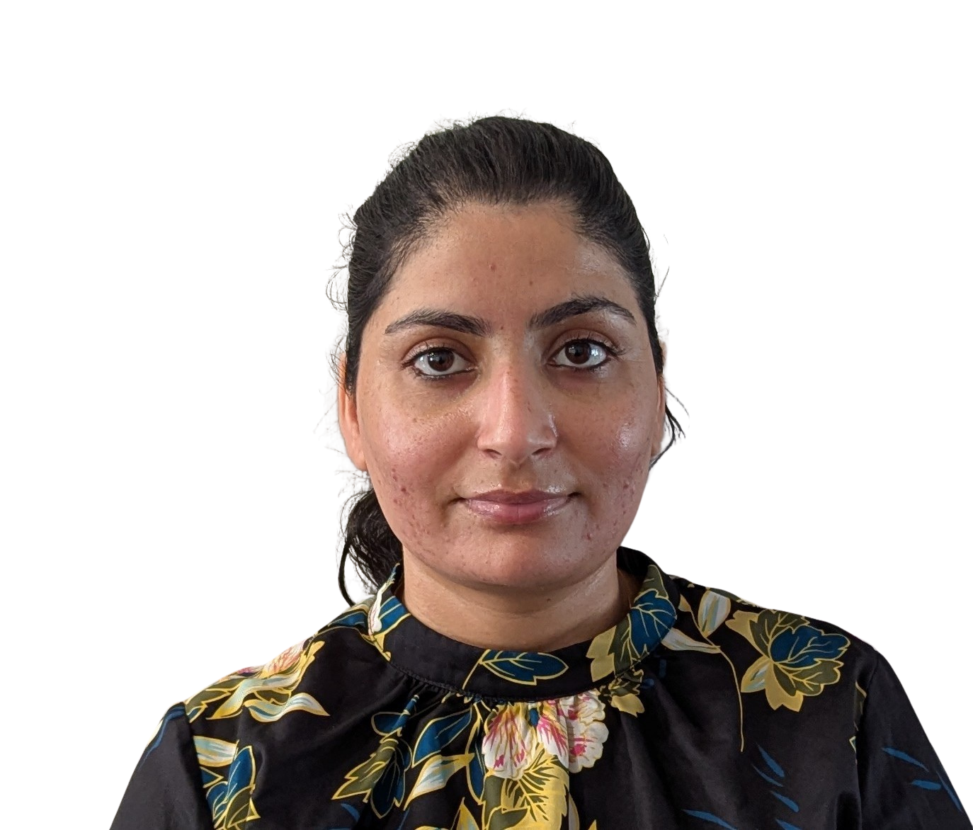 Portrait of a woman in a floral blouse against a plain wall