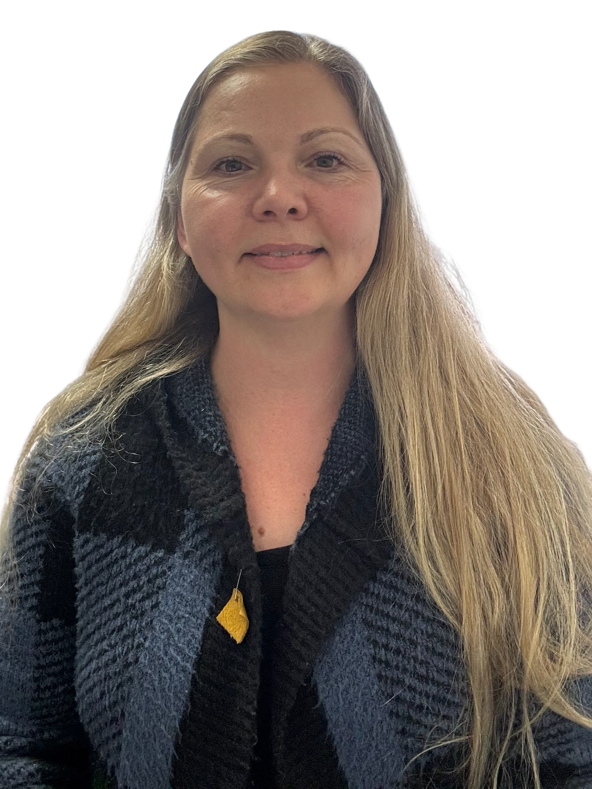 Woman with long blonde hair, wearing a black and blue patterned cardigan and black shirt, looking at the camera.