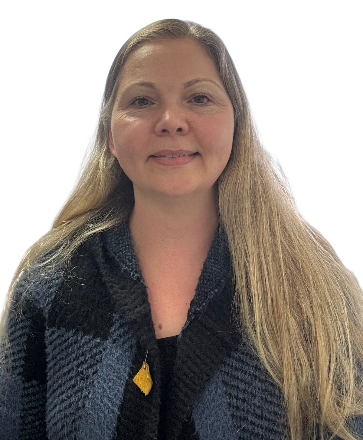 Woman with long blonde hair, wearing a black and blue patterned cardigan, smiling.
