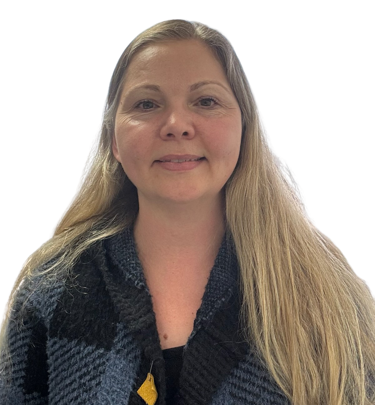 Woman with long blonde hair, wearing a dark blue and black plaid sweater, smiling at the camera.