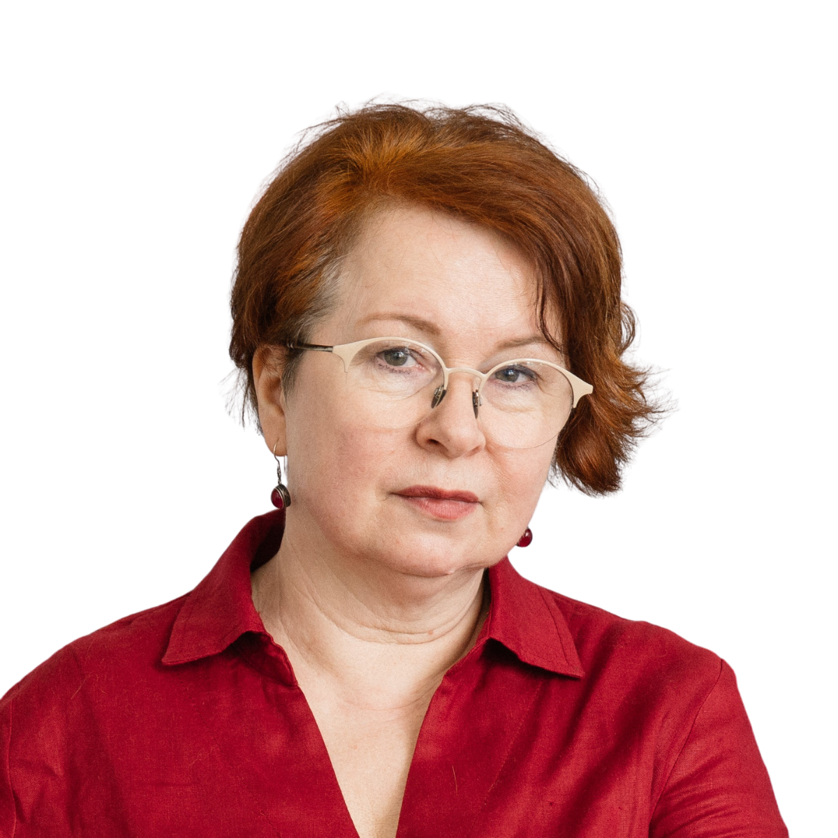 Woman with red hair and glasses wearing a red shirt, looking at the camera.