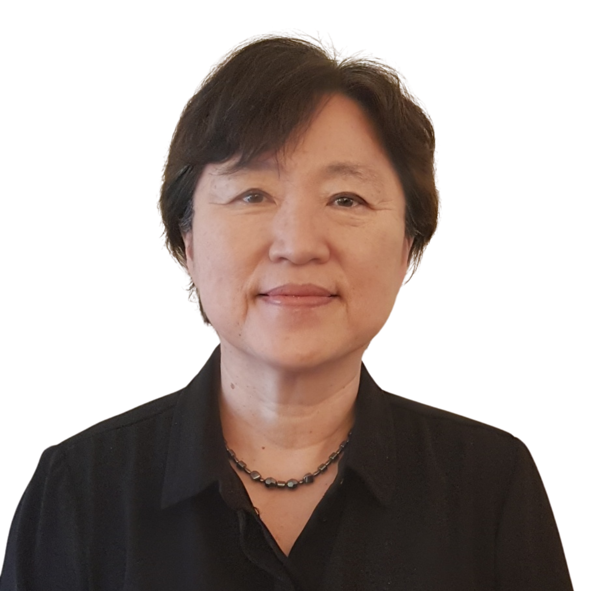Woman with dark hair, wearing a black shirt, smiling, and looking at the camera.