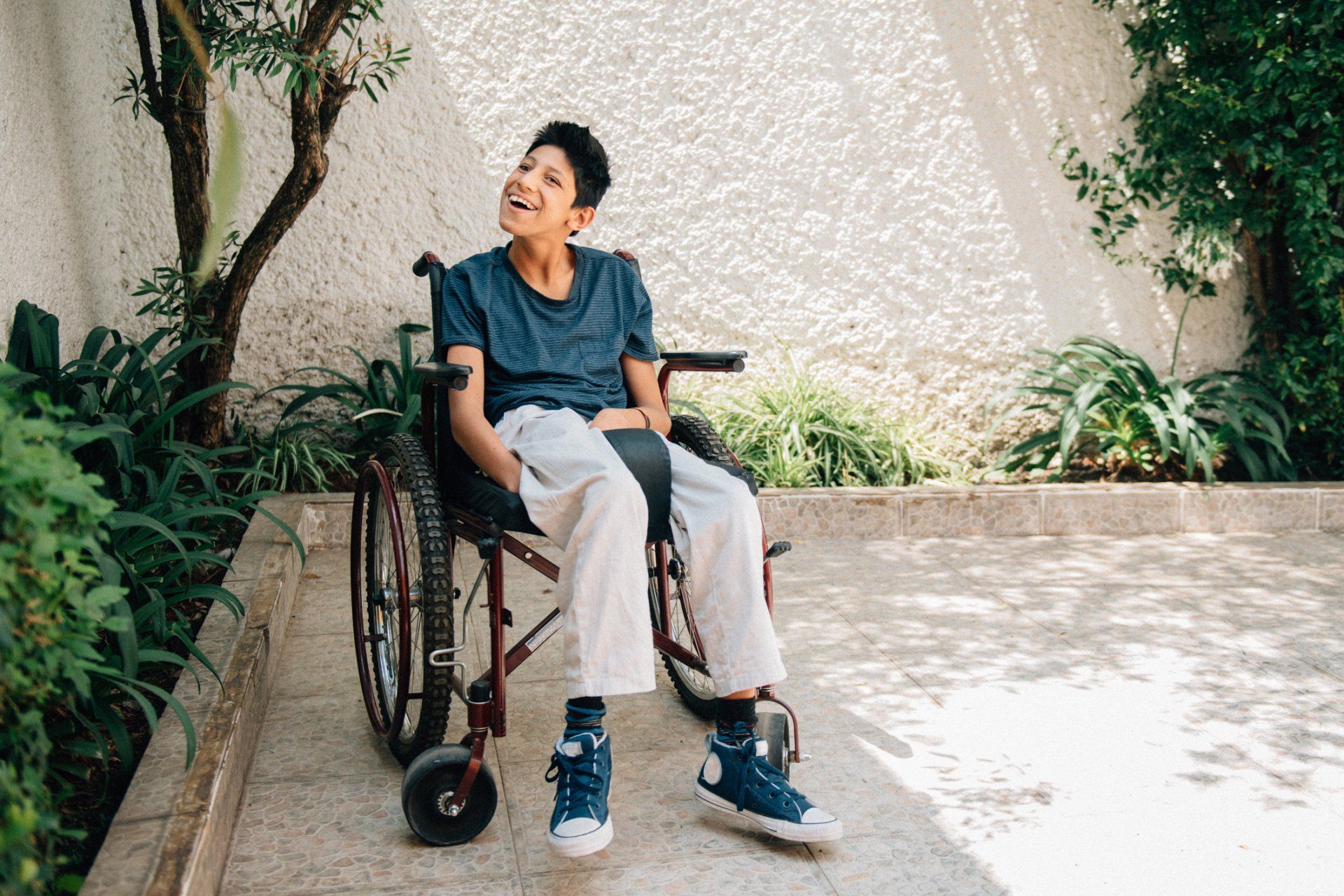 Children on Wheelchair  Photo - Click to Go to contacts