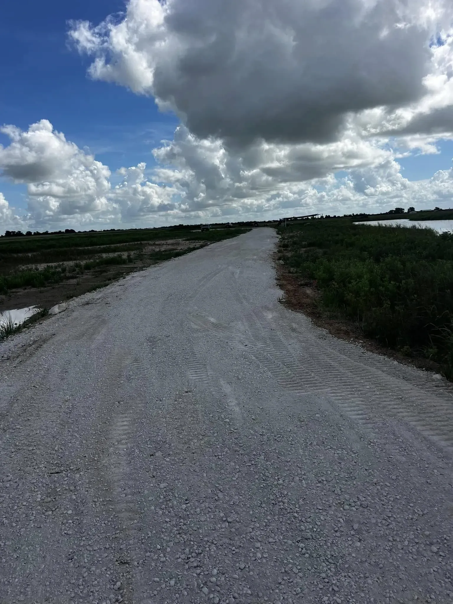 Private road construction with compacted base material in Texas