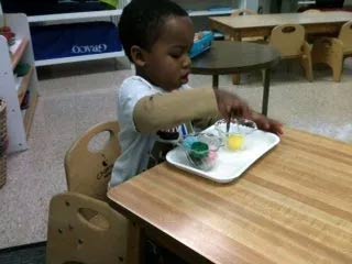 Child Playing with Colors — Woodridge, IL — Montessori of Woodridge