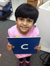 Child Holding a Letter — Woodridge, IL — Montessori of Woodridge