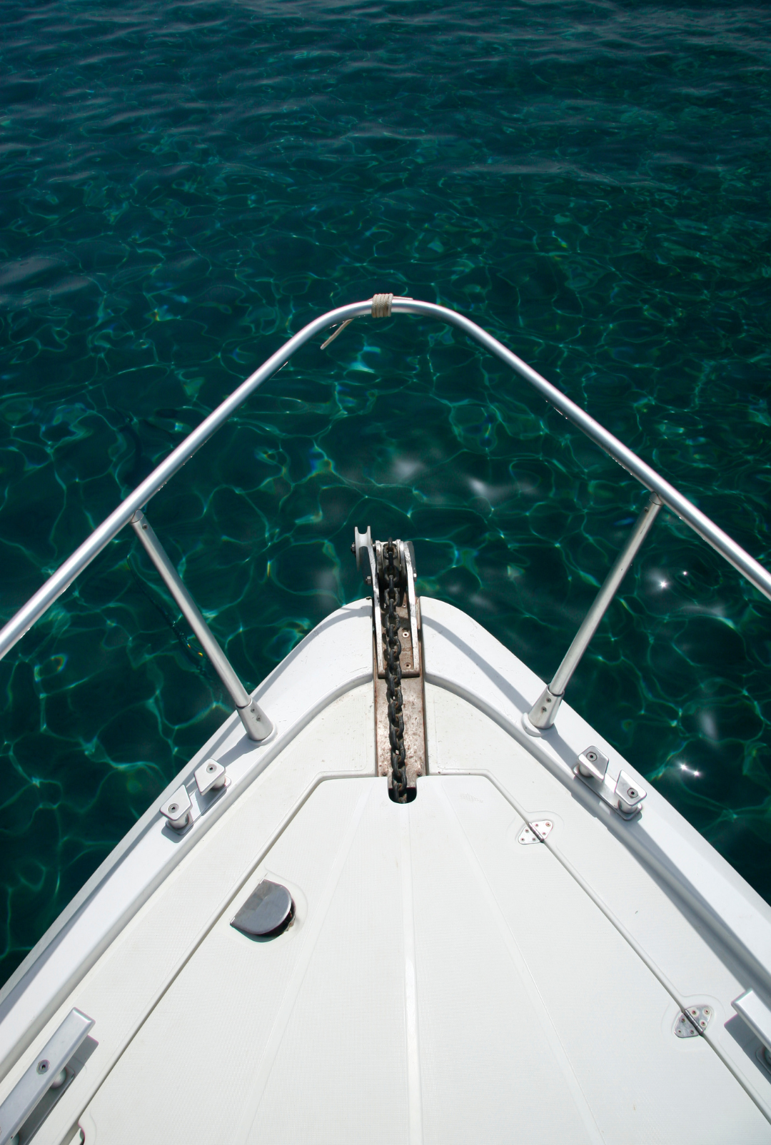 A boat is floating on top of a body of water.