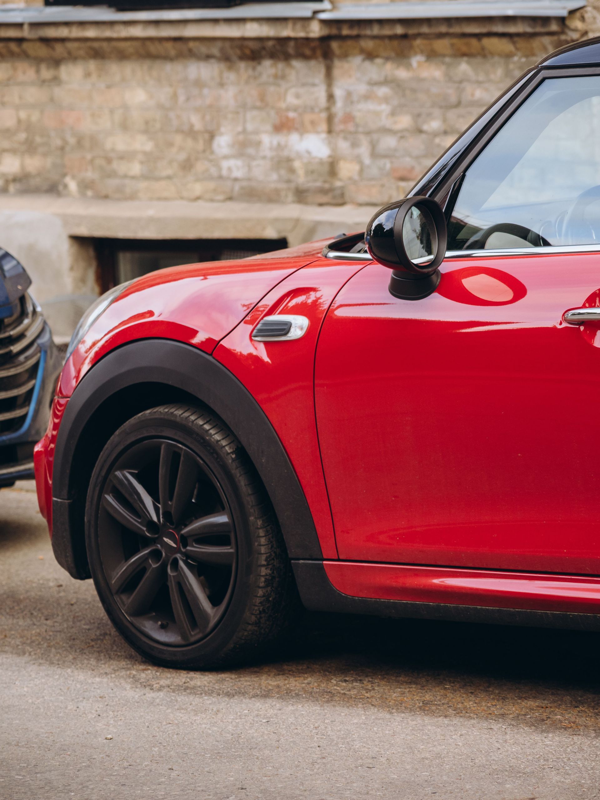 a picture of a red car parked.