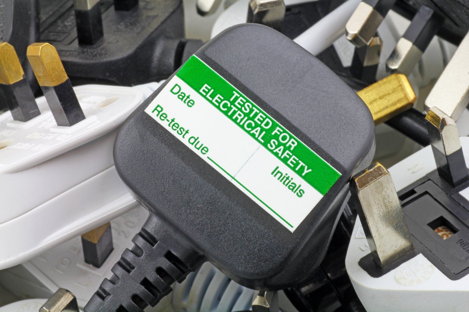 Close-up of a black electrical plug with a
