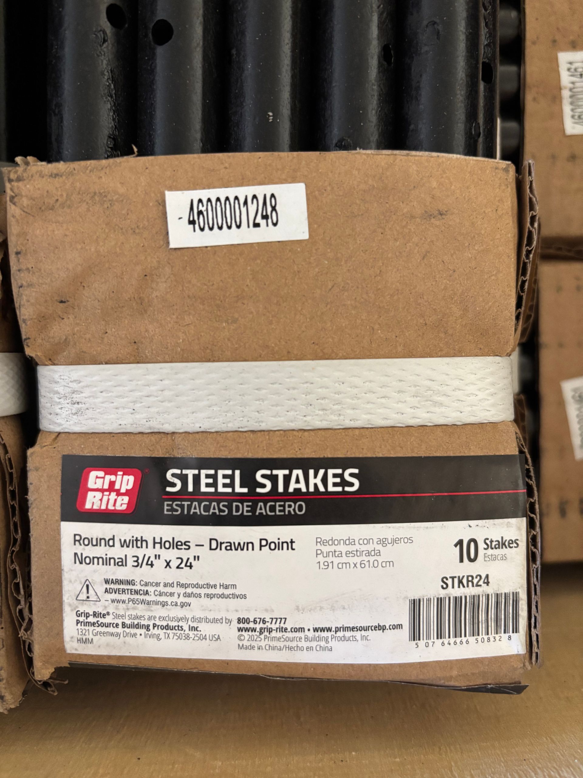 Box of black steel stakes in store packaging, labeled 