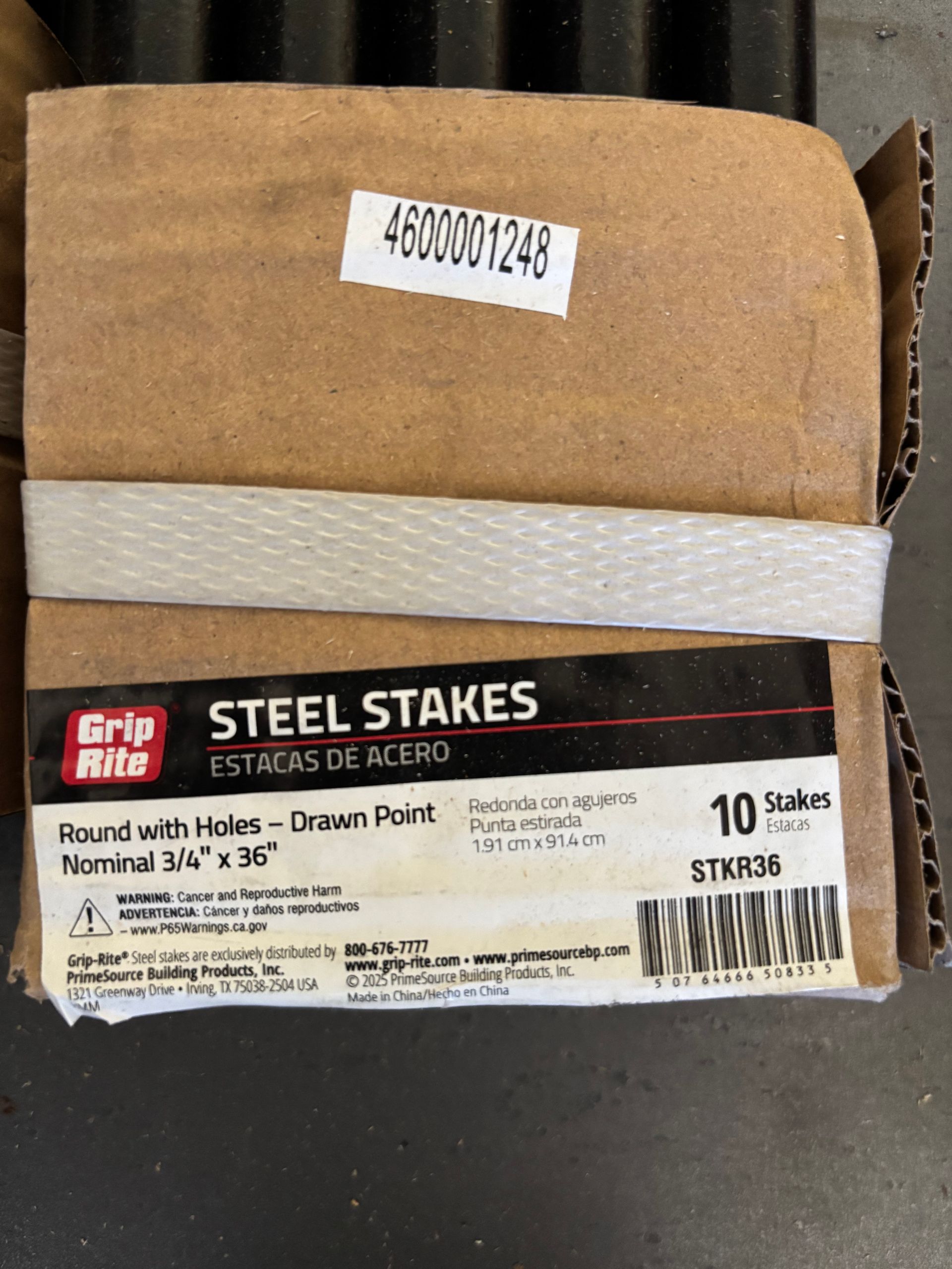 Box of Grip Rite steel stakes in brown packaging with a white band and product label
