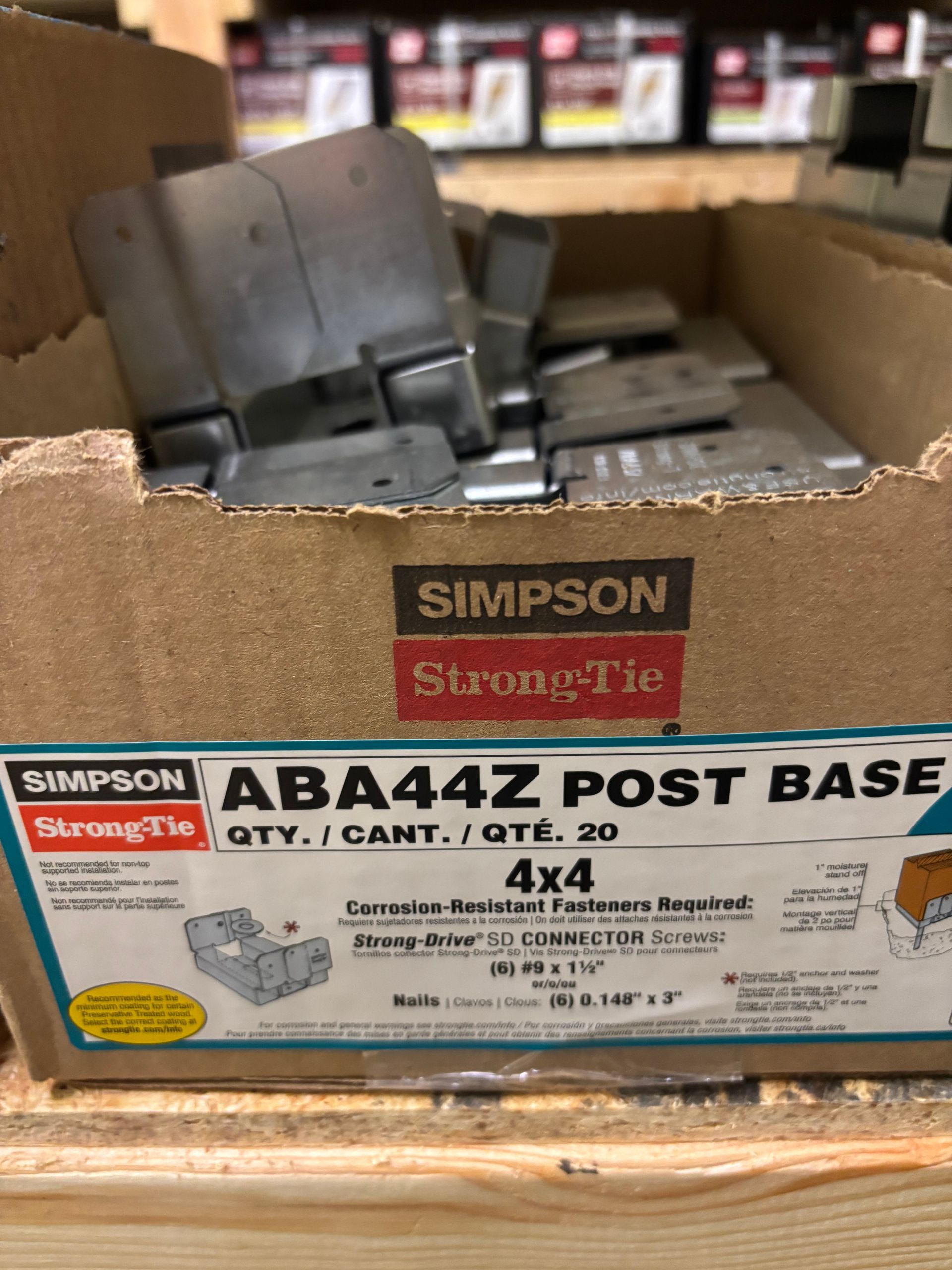 Box of Simpson Strong-Tie ABA44Z post base connectors on a store shelf