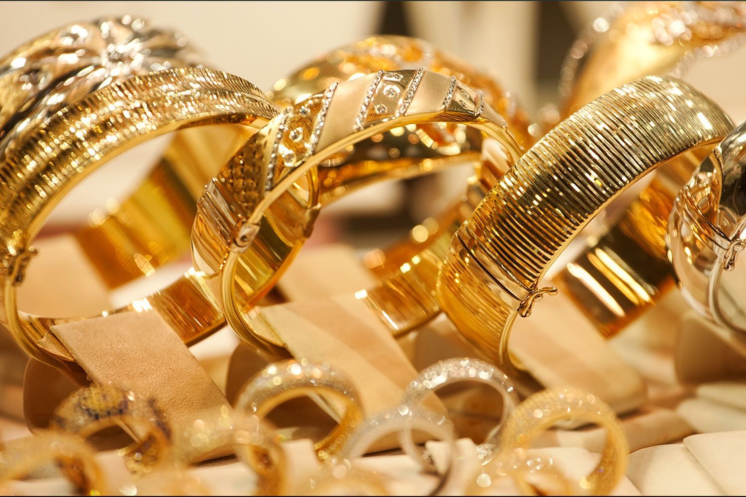 Gold bracelets and rings on display.