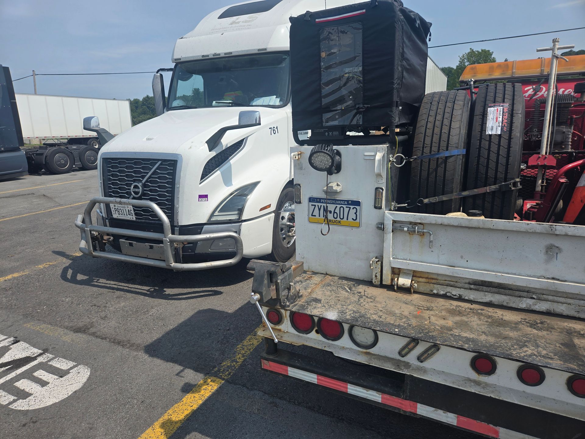 Leesa Diesel mobile service truck beside a Volvo semi truck for tire repair