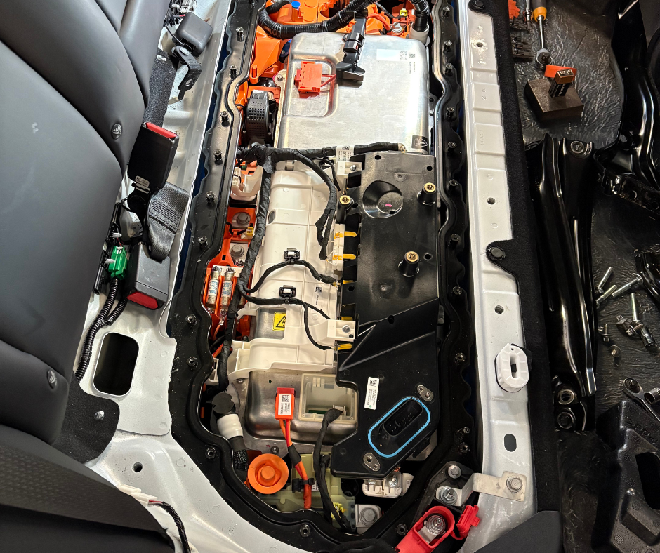 The inside of a car with the engine removed