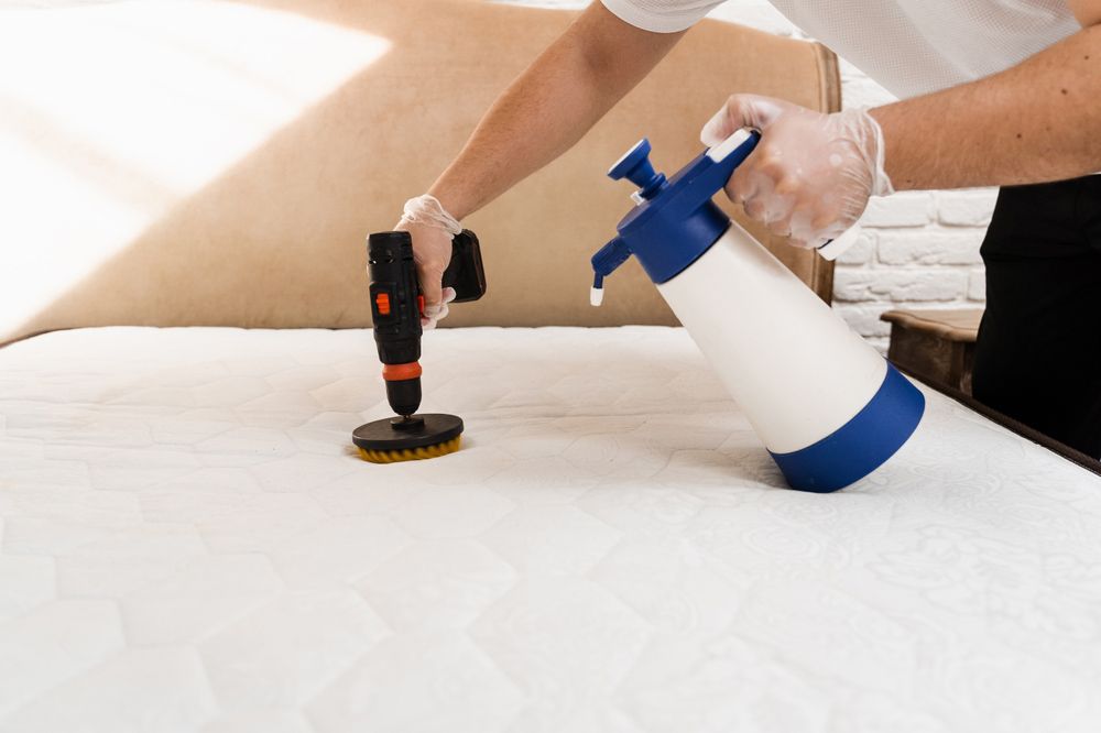 A Person is Cleaning a Mattress With a Spray Bottle and a Drill — Cleaning for Good in Alstonville, NSW