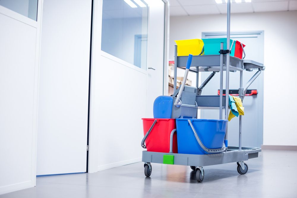 A Cleaning Cart With Buckets and Mops in a Hallway — Cleaning for Good in Mullumbimby, NSW