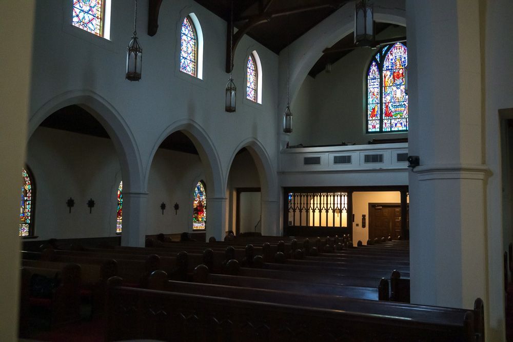 The inside of a church with stained glass windows