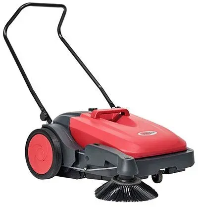 Red and black push-operated floor sweeper with a handle and rotating side brush.