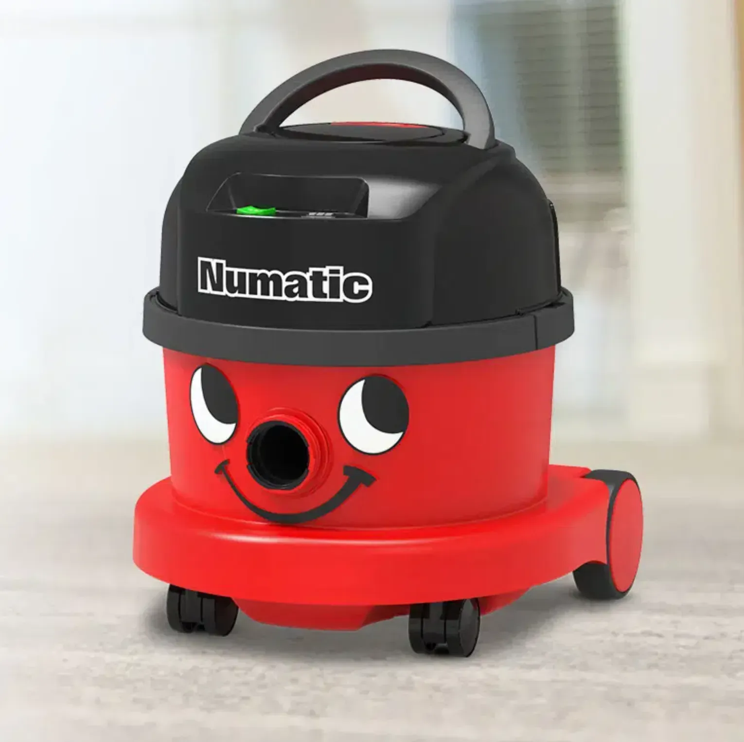 Red and black Numatic "Henry" vacuum cleaner with a smiling face.