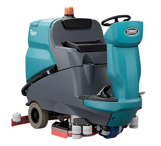 Turquoise and gray industrial floor sweeper with a steering wheel and flashing light.