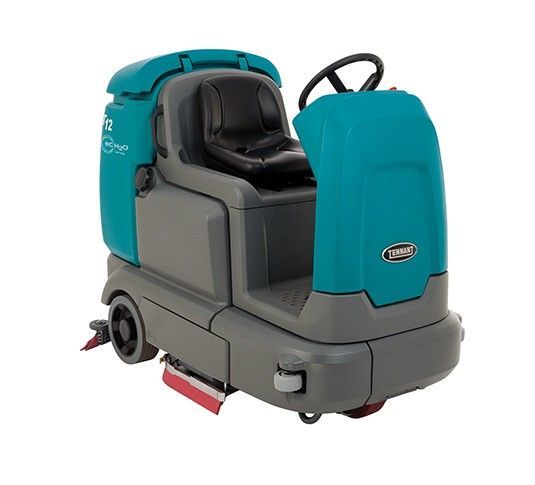 Teal and gray industrial floor scrubber with a seat and steering wheel.