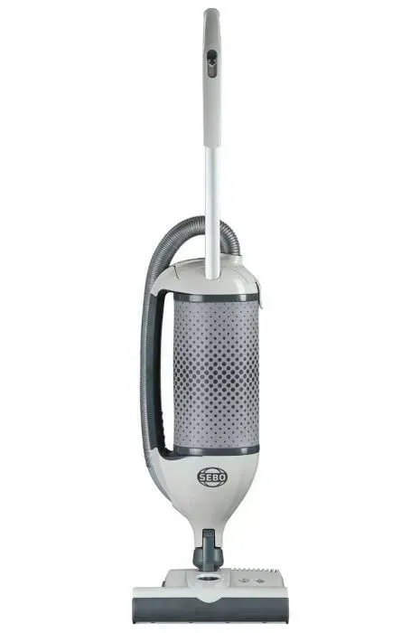 Upright gray and white vacuum cleaner with a long handle and cylindrical body.