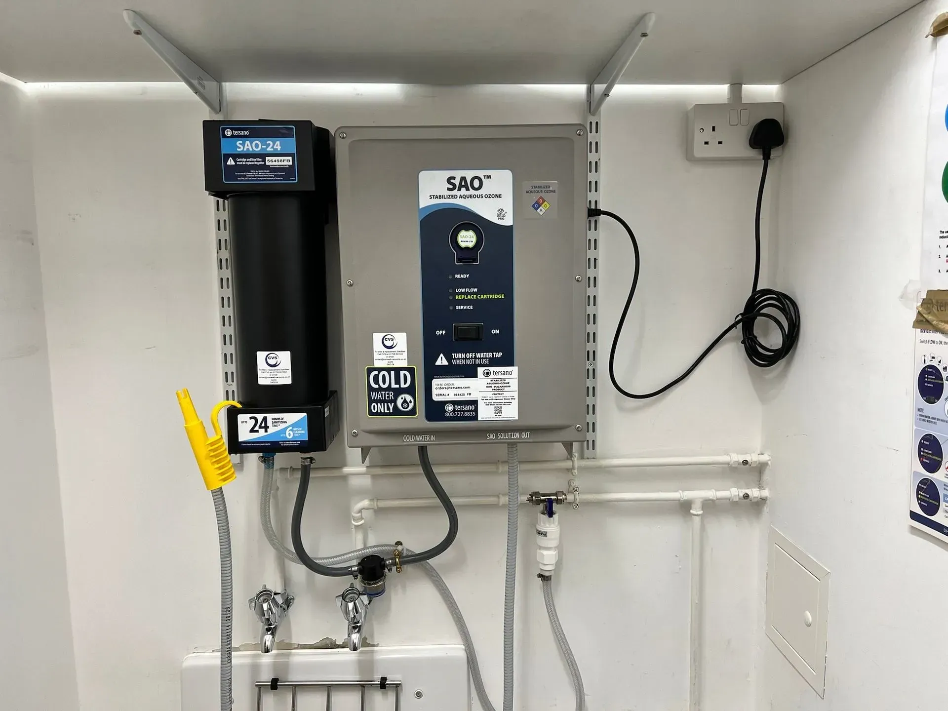 Water filtration system with a filter and a control box.