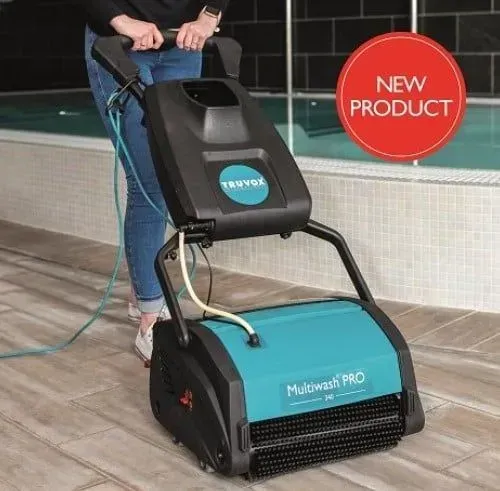 Person using a teal and black Truvox Multiwash PRO floor cleaning machine near a pool. 