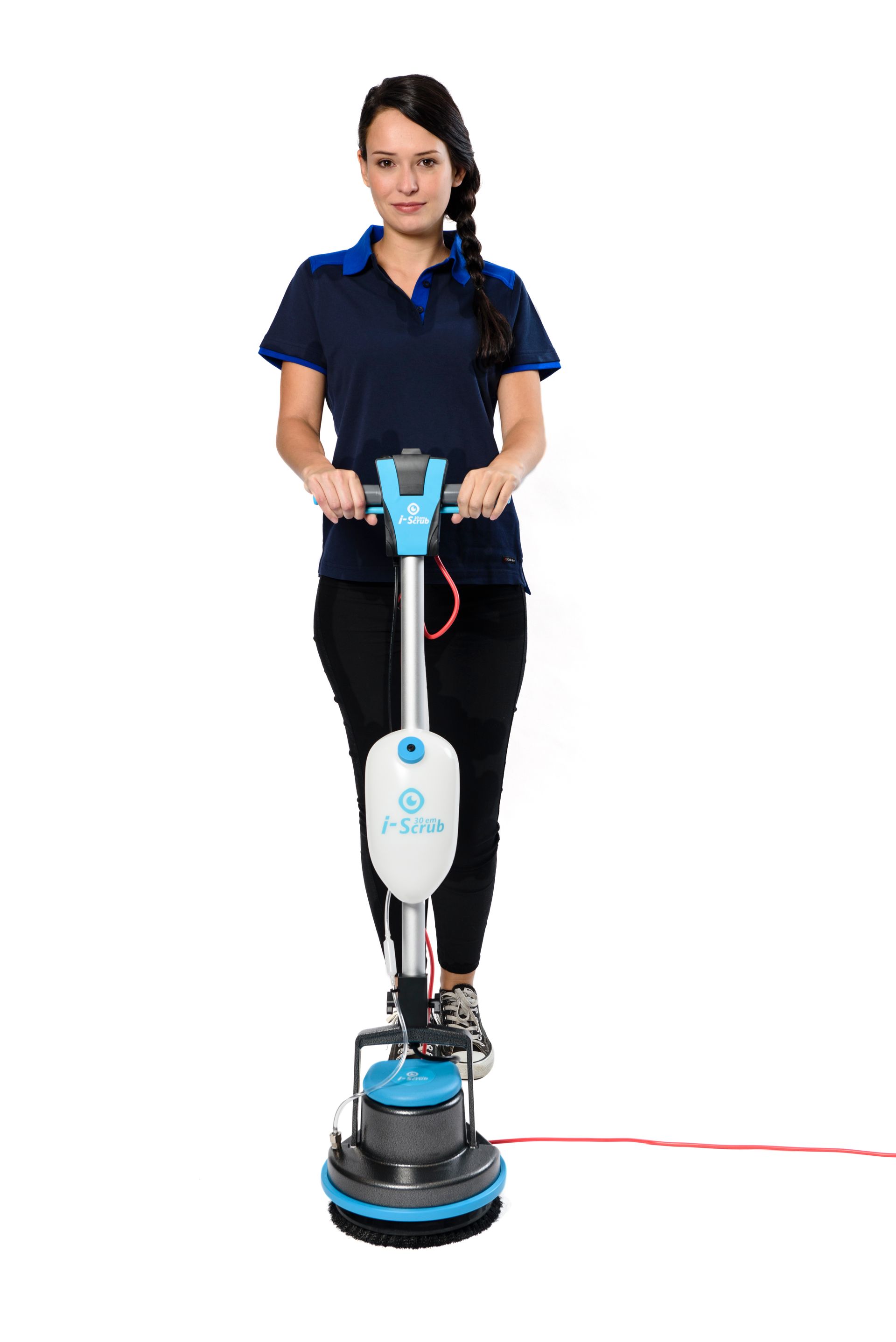 Woman operating a blue and white floor cleaning machine. She is wearing a dark blue shirt and black pants.