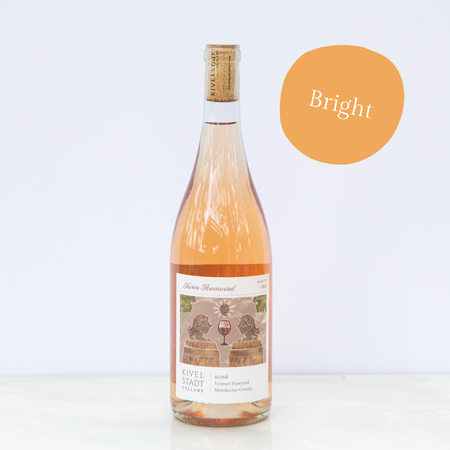 A bottle of wine with an orange circle that says bright