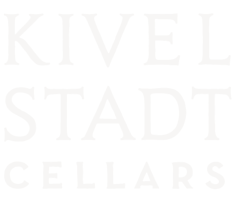 A white logo for kivel stadt cellars on a white background.