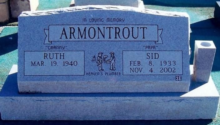 Blue gravestone for the Armontrout family with names and dates engraved on it.