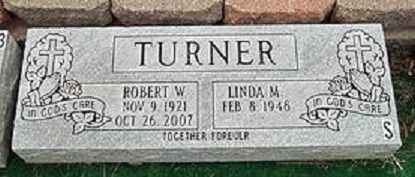 Gray Turner family gravestone with engraved names and dates, decorated with floral side panels.
