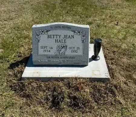 Gravestone for Betty Jean Hale on a concrete base in a grassy cemetery plot.