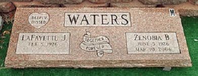 WATERS family gravestone with three plaques on a stone memorial bench outdoors