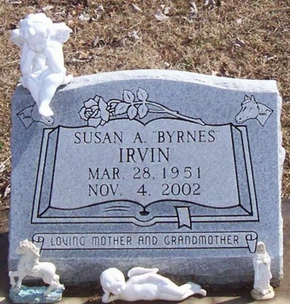 Gravestone for Susan A. Byrnes Irvin with white angel figurines and “loving mother and grandmother” inscription