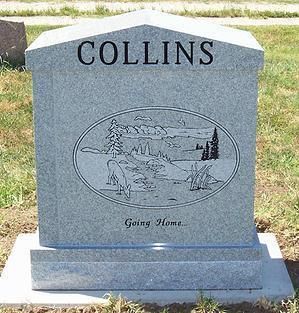 Gray Collins gravestone with engraved landscape and the words “Going Home.”